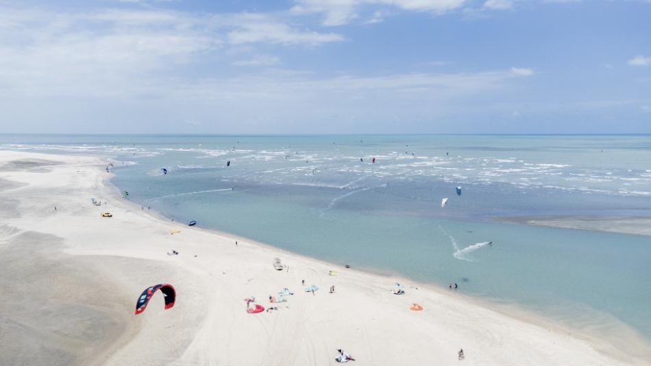 kitesurfers freeriding and waveriding in the rivermouth in Tatajuba Brazil