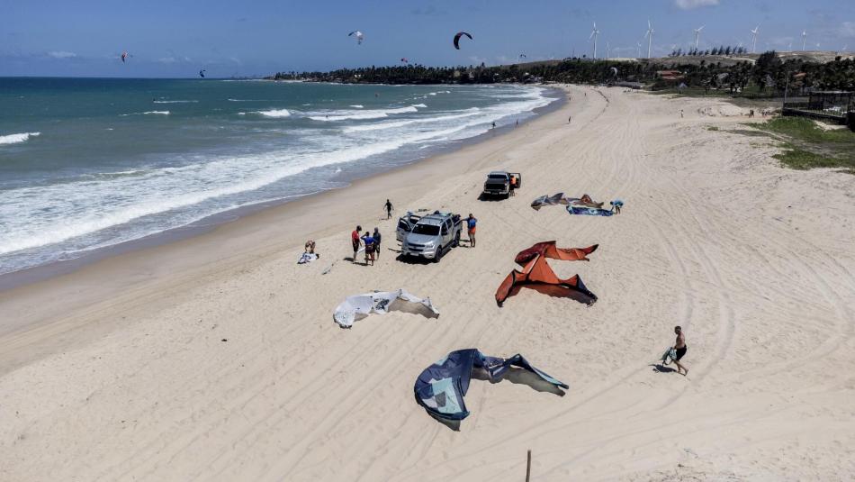 main kite beach in Taiba, Brazil, where kitesurfers are preparing their kites for the wave session